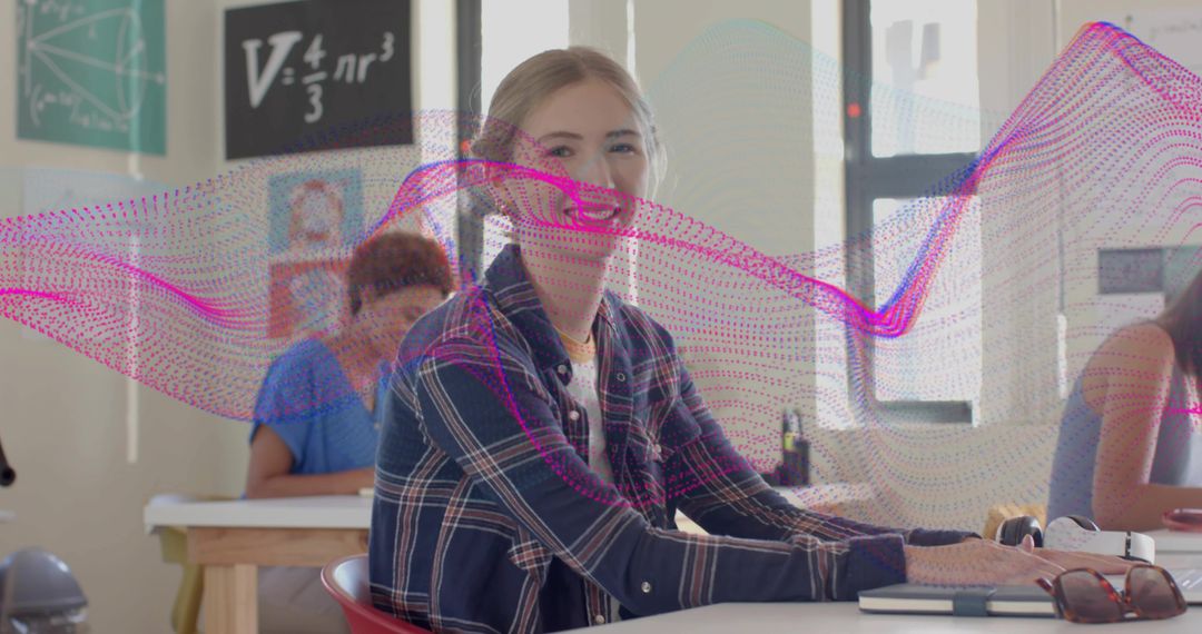 Smiling student sitting at classroom desk with magenta data wave overlay modern learning
