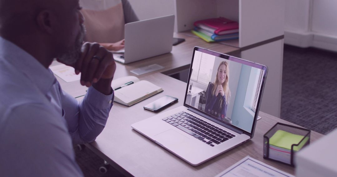 Business Professional Engaged in Virtual Meeting with Colleague