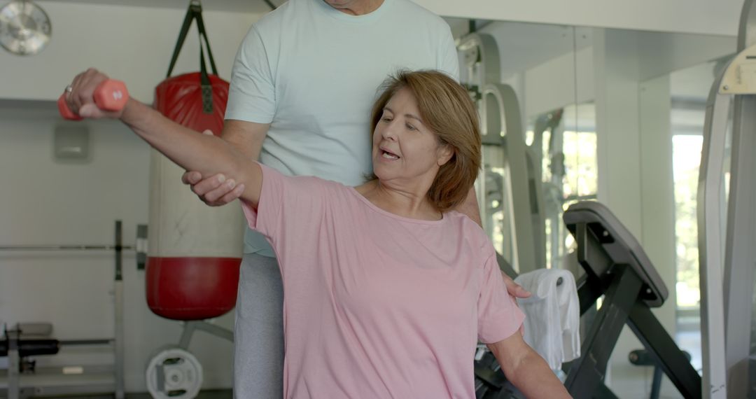 Senior Couple Enjoying Fitness Routine in Gym Environment