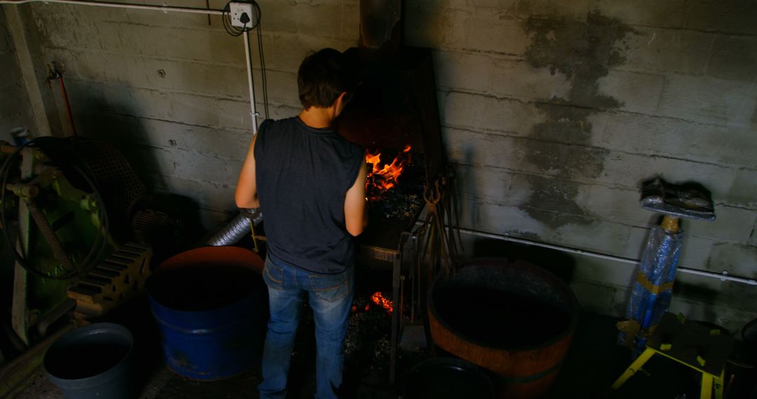 Young Metalsmith Forges Horseshoe in Workshop Fire - Free Images, Stock Photos and Pictures on Pikwizard.com