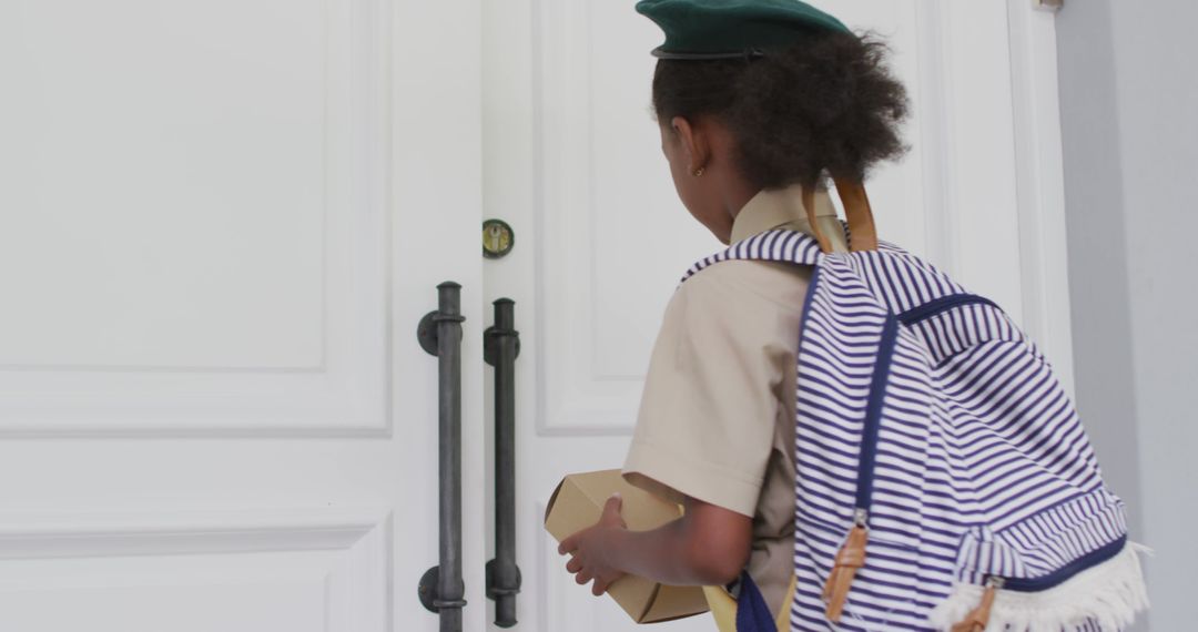 Young Girl Scout Delivering Package with Enthusiasm - Free Images, Stock Photos and Pictures on Pikwizard.com