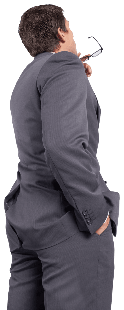 Thoughtful Businessman in Gray Suit Holding Transparent Frames