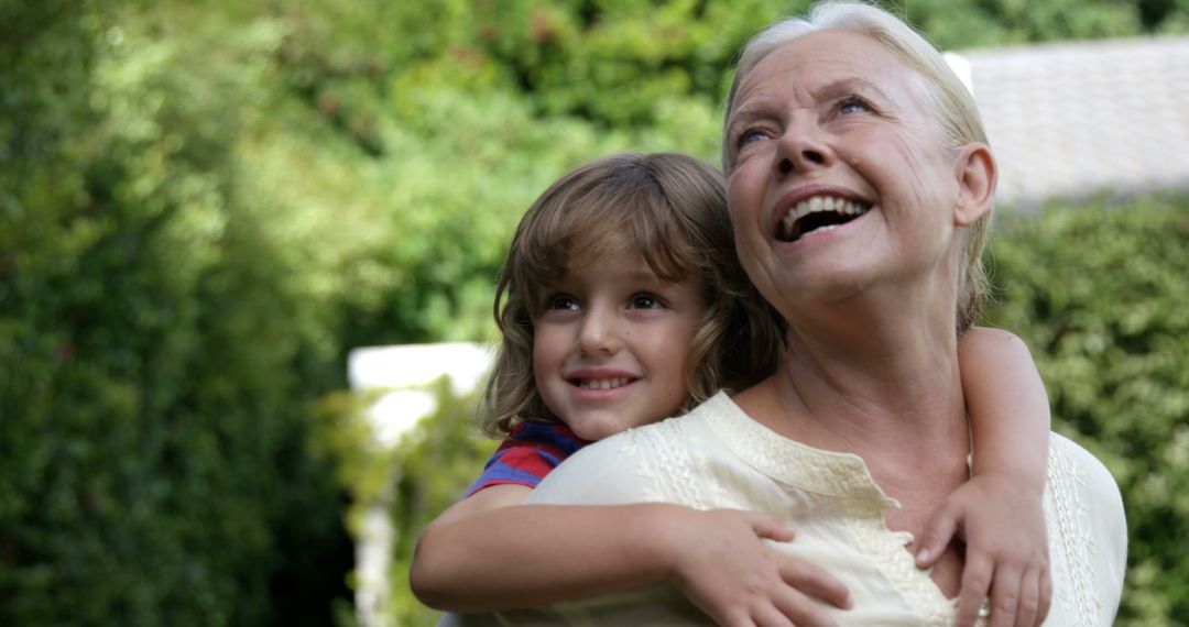 Smiling Grandmother and Grandchild Enjoying Garden - Free Images, Stock Photos and Pictures on Pikwizard.com