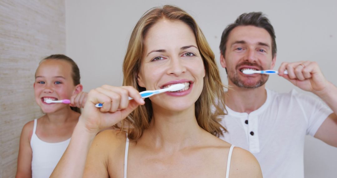 Happy Family Brushing Teeth Together in Bright Bathroom - Free Images, Stock Photos and Pictures on Pikwizard.com