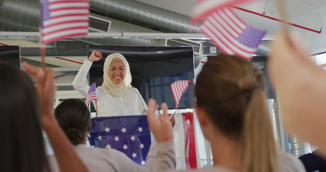 Muslim Woman in Hijab Giving Empowering Speech Waving American Flag - Free Images, Stock Photos and Pictures on Pikwizard.com