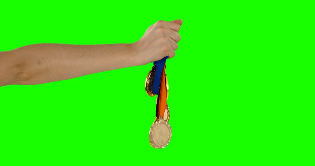 Hand Holding Medals on Green Screen Background - Free Images, Stock Photos and Pictures on Pikwizard.com