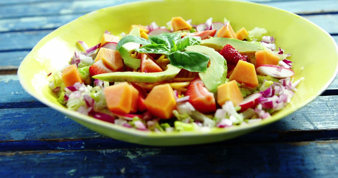 Colorful Fresh Salad in Yellow Bowl on Rustic Table - Free Images, Stock Photos and Pictures on Pikwizard.com