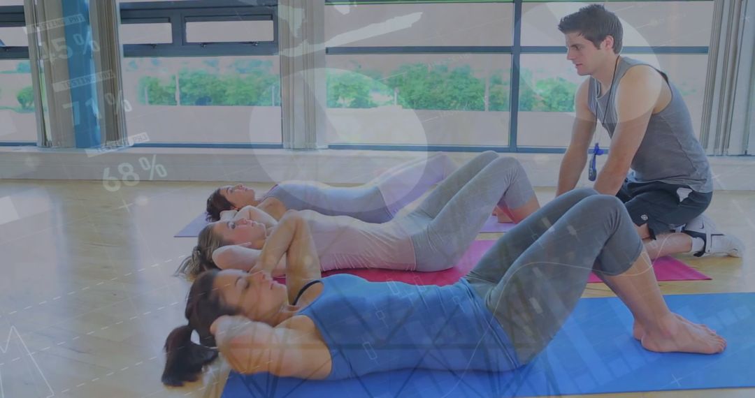 Group Exercise Class with Instructor Leading Sit-up Routine