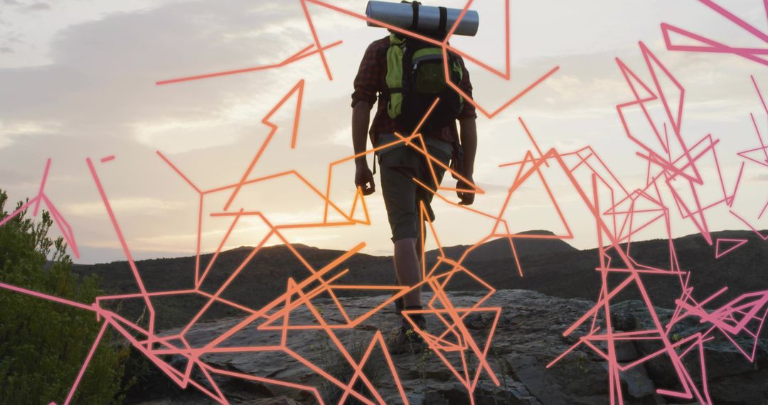Silhouette of Hiker on Rocky Ridge with Neon Pathway