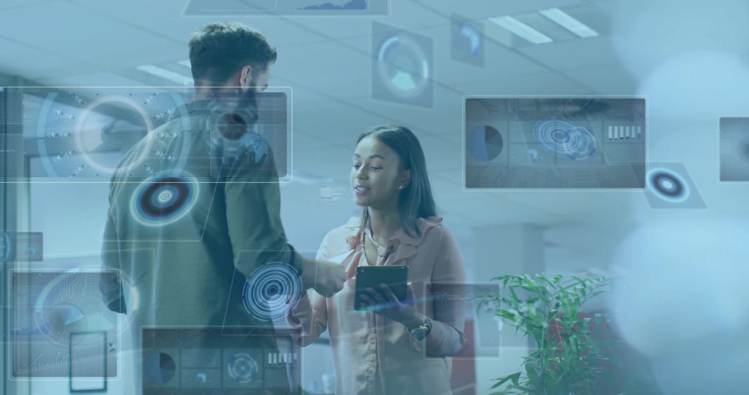 Colleagues Collaborating with Holographic Data Displays Using Tablet in Modern Office Workspace