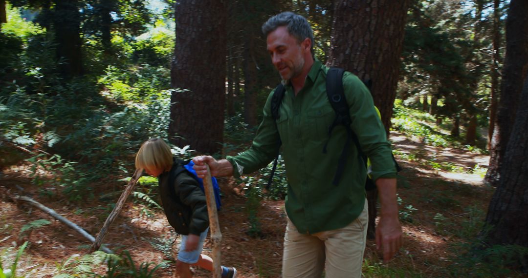 Father and Daughter Hiking Together in Lush Forest - Free Images, Stock Photos and Pictures on Pikwizard.com