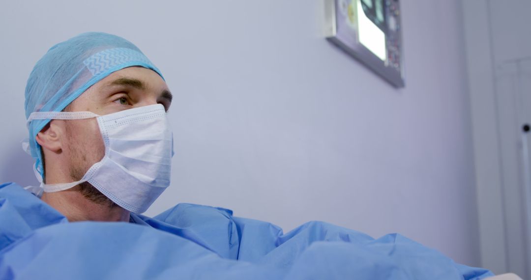 Surgeon Wearing Mask and Scrubs in Operating Room - Free Images, Stock Photos and Pictures on Pikwizard.com