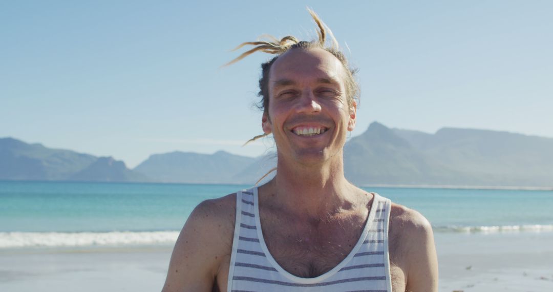 Happy Man with Dreadlocks at Beach on Sunny Day - Free Images, Stock Photos and Pictures on Pikwizard.com