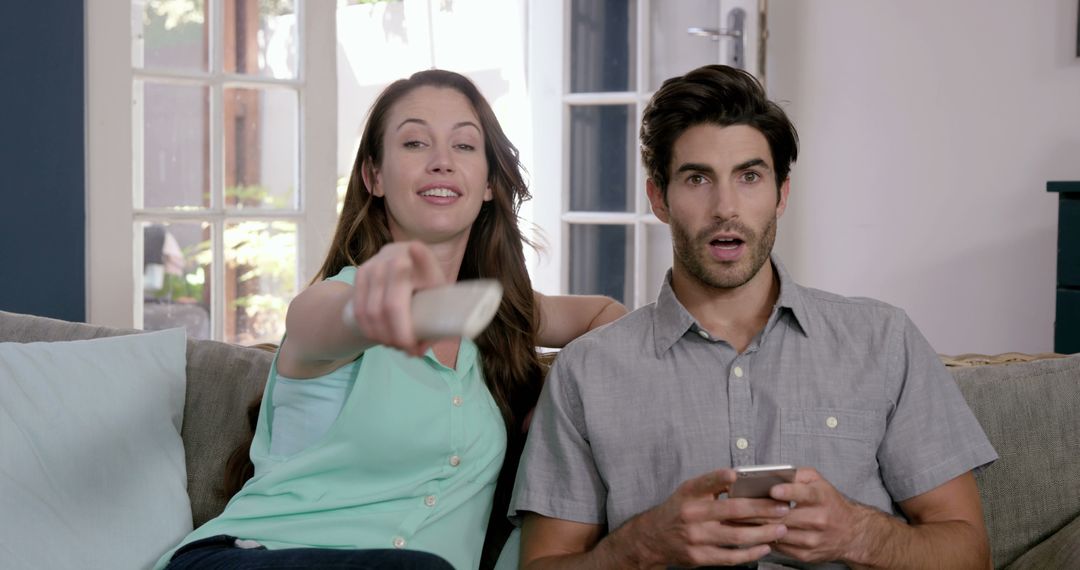 Couple Relaxation with TV and Smartphone at Home