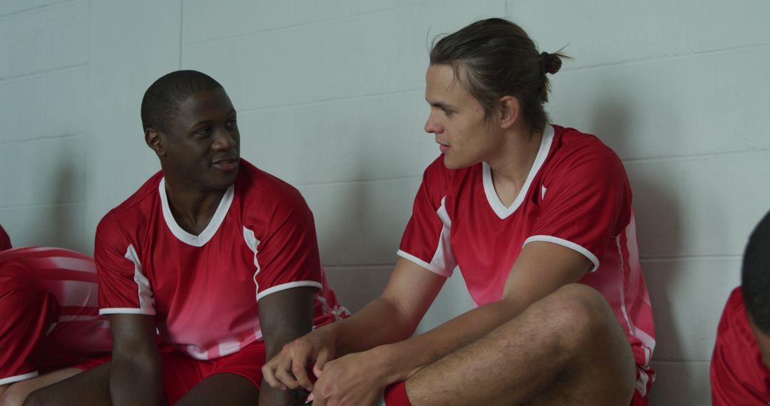 Multiracial Soccer Players Resting and Communicating in Locker Room - Free Images, Stock Photos and Pictures on Pikwizard.com