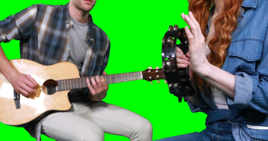 Musicians Playing Acoustic Guitar and Tambourine Together, Green Screen - Free Images, Stock Photos and Pictures on Pikwizard.com