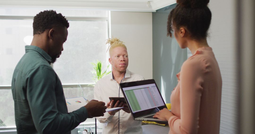 Diverse Team Collaborating Inside Creative Office Space