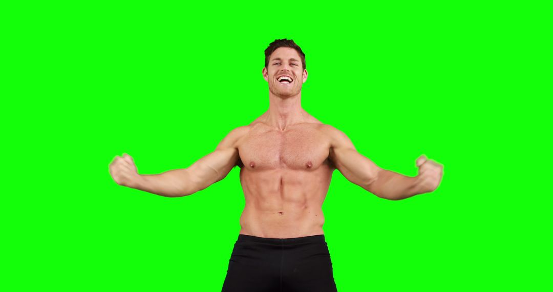 Fit Man Flexing Muscles Smiling with Green Screen Background - Free Images, Stock Photos and Pictures on Pikwizard.com