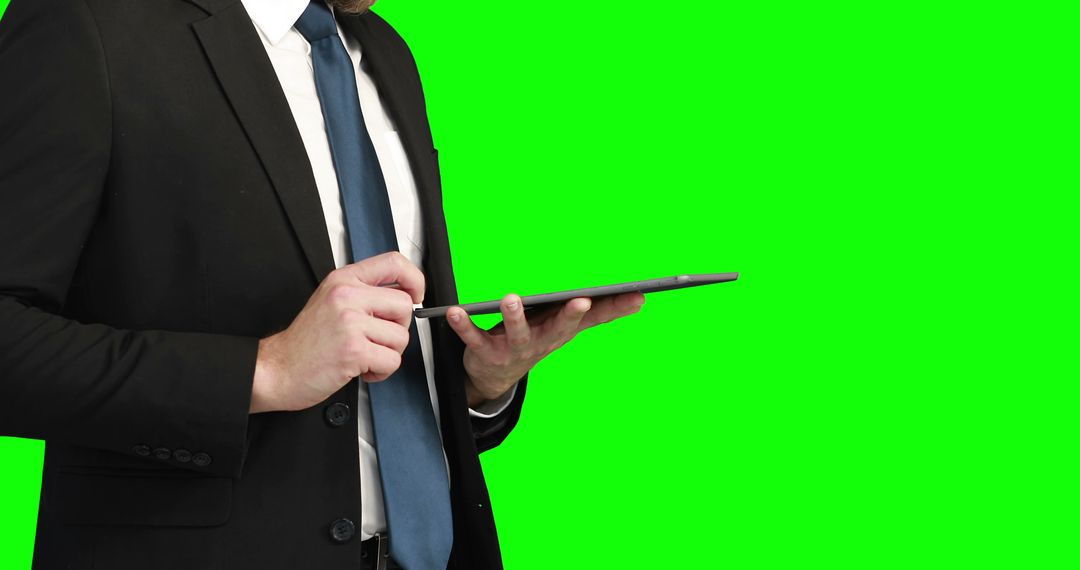 Businessman Using Digital Tablet Isolated on Green Screen - Free Images, Stock Photos and Pictures on Pikwizard.com