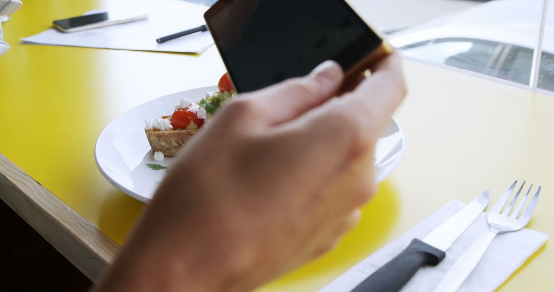 Person Capturing Meal with Smartphone in Café - Free Images, Stock Photos and Pictures on Pikwizard.com