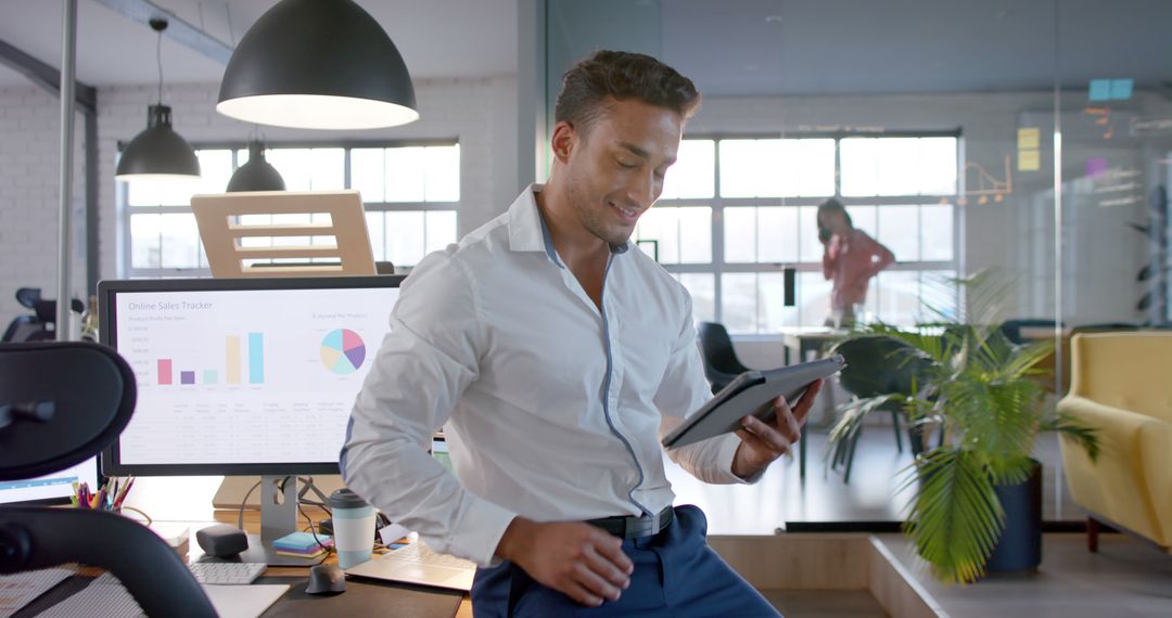 Happy Caucasian Businessman Using Tablet in Casual Office - Free Images, Stock Photos and Pictures on Pikwizard.com