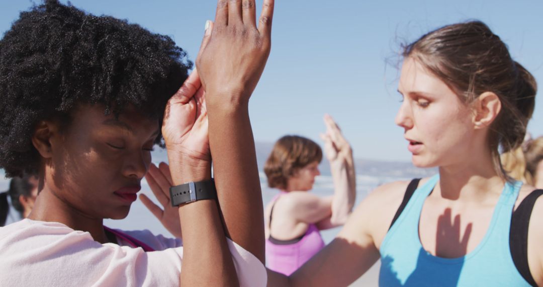 Women Practicing Yoga on Beach in Group Class under Clear Sky - Free Images, Stock Photos and Pictures on Pikwizard.com