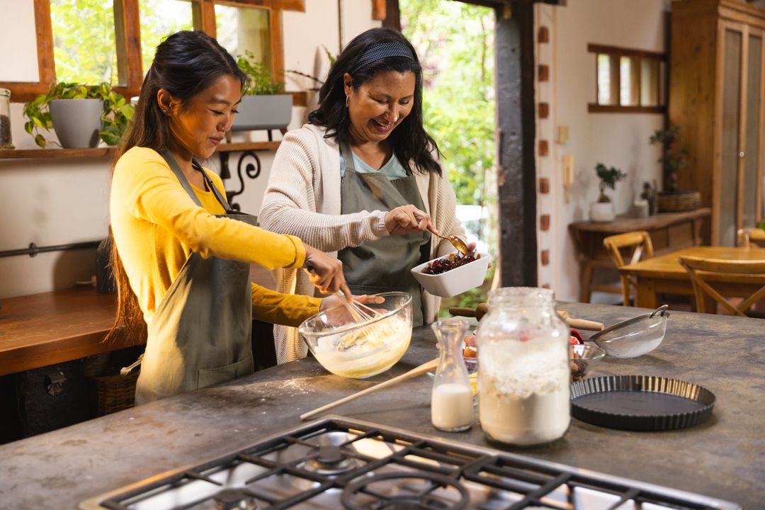 Diverse Female Friends Enjoying Baking Together in Rustic Kitchen