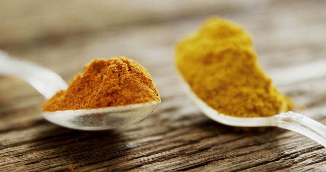 Close-Up of Ground Spices on Wooden Surface - Free Images, Stock Photos and Pictures on Pikwizard.com