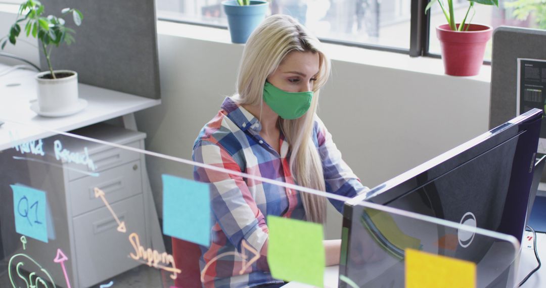 Woman Working in Office During Pandemic - Free Images, Stock Photos and Pictures on Pikwizard.com