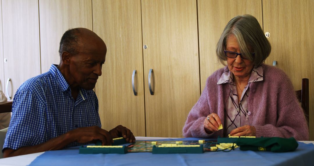 Seniors Engaging in Puzzle Game at Retirement Home