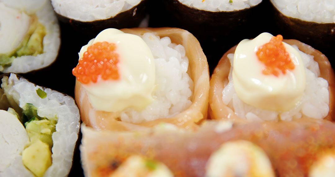 Close-up of Various Sushi Rolls with Roe and Mayonnaise - Free Images, Stock Photos and Pictures on Pikwizard.com