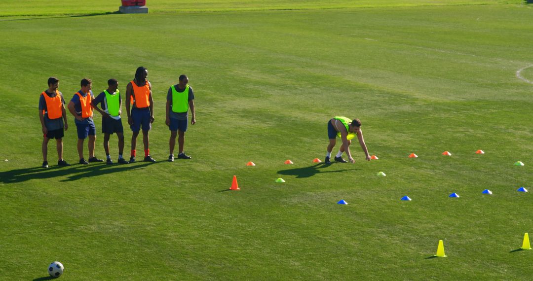 Soccer Training Session with Young Athletes on Grass Field - Free Images, Stock Photos and Pictures on Pikwizard.com