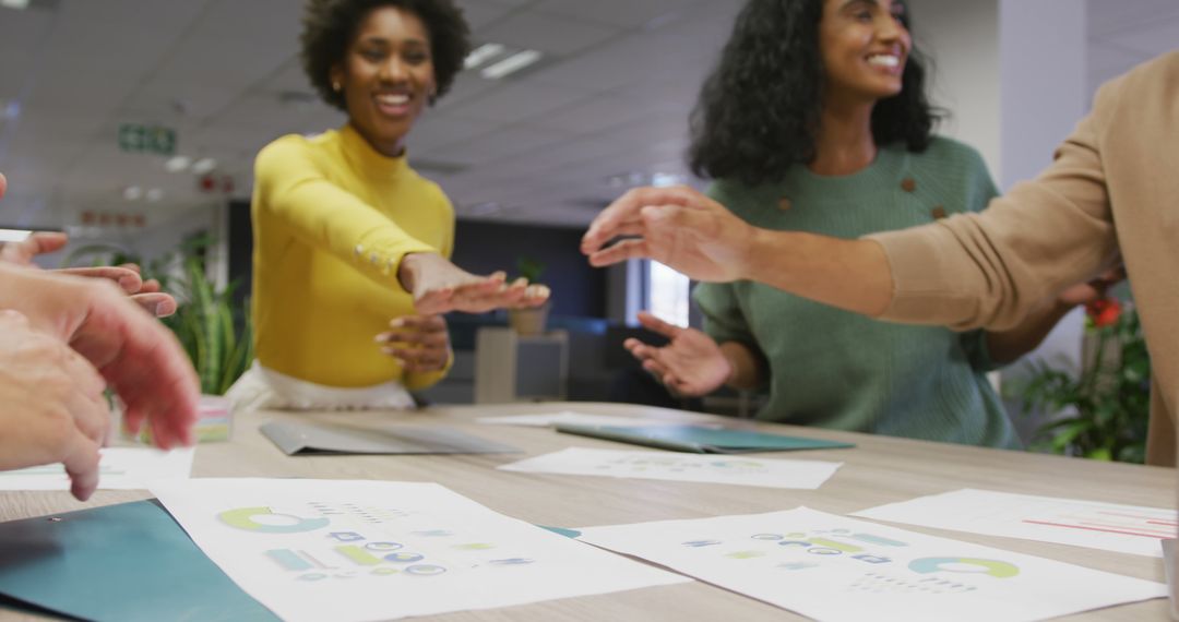 Diverse Team Energetically Collaborating in Modern Office