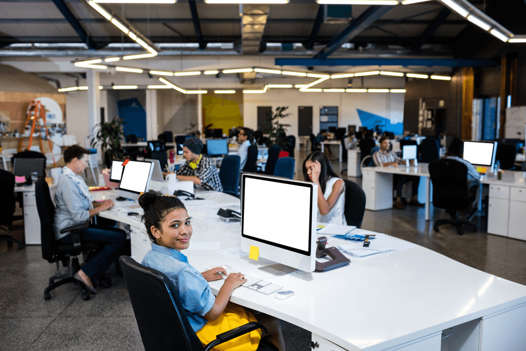 Happy Professional Working in Modern Transparent Office