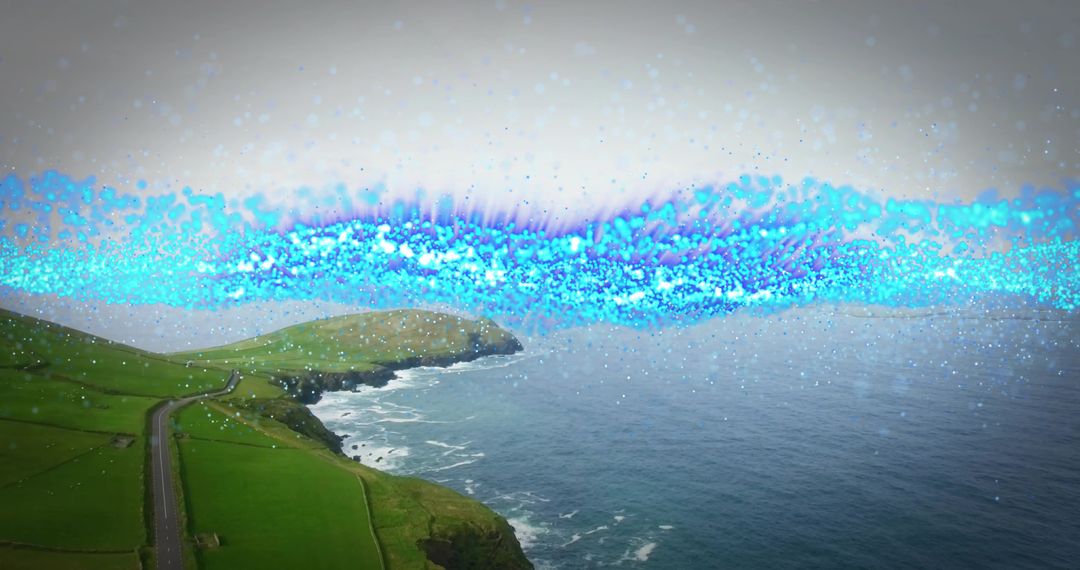 Winding coastal road hugging green cliffs with glowing blue light ribbon over ocean