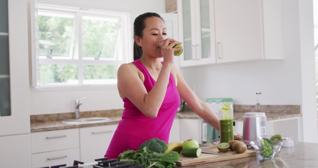 Woman Enjoying a Healthy Smoothie in Modern Kitchen - Free Images, Stock Photos and Pictures on Pikwizard.com