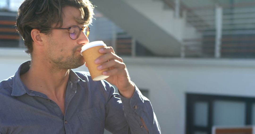 Man Enjoying Coffee While Standing Outdoors - Free Images, Stock Photos and Pictures on Pikwizard.com