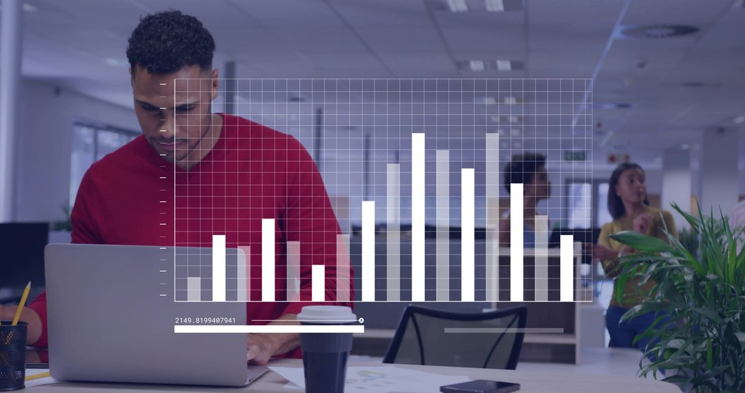 Professional Analyzing Bar Chart on Laptop in Modern Office Setting