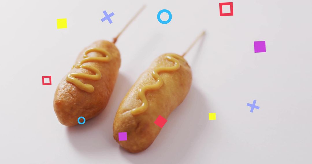 Playful Corn Dogs with Mustard and Geometric Shapes
