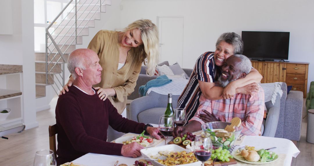 Senior Friends Enjoying Meal and Embracing Each Other - Free Images, Stock Photos and Pictures on Pikwizard.com