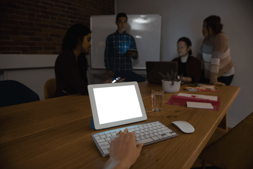 Transparent Office Meeting with Tablet Showing Blank Screen