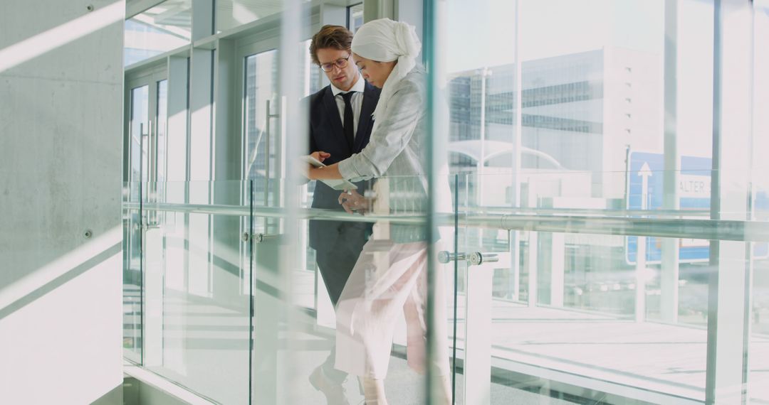 Professional Collaboration Between Colleagues in Modern Office