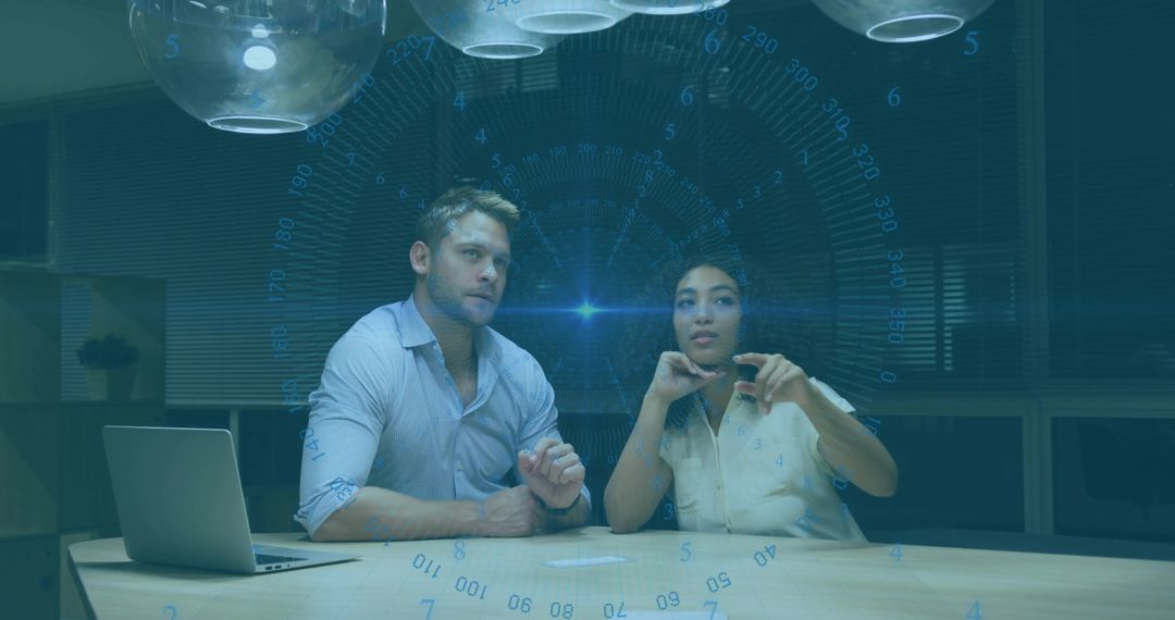 Colleagues Brainstorming with Technology in Modern Office