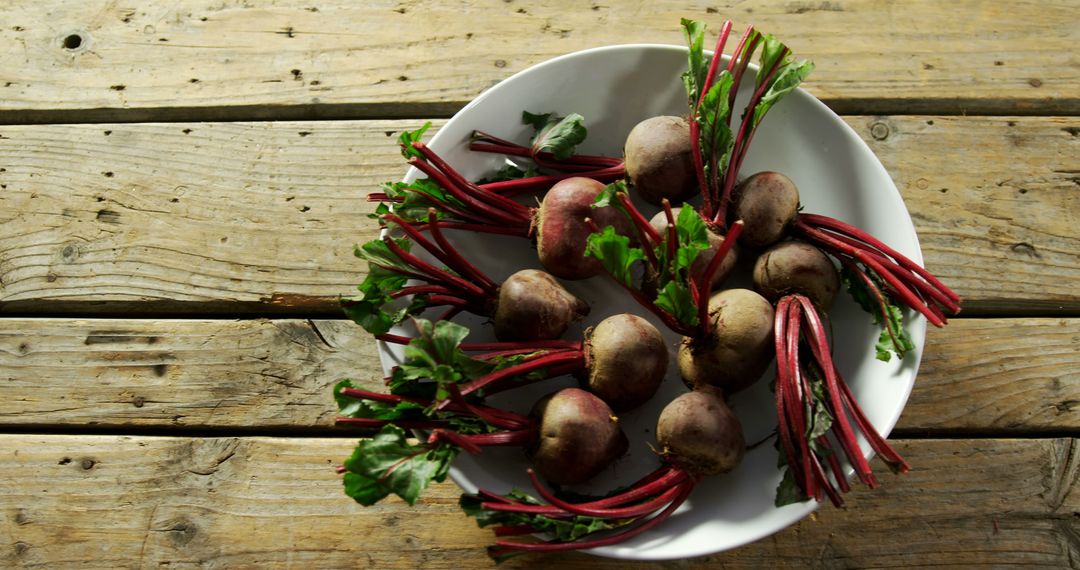 Fresh Beetroots with Leaves on Rustic Wooden Table - Free Images, Stock Photos and Pictures on Pikwizard.com