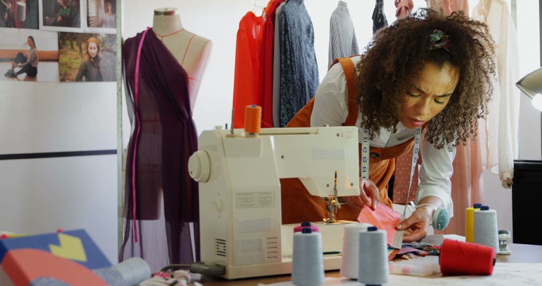 Fashion Designer Examining Cloth Samples in Creative Workshop