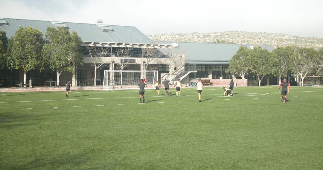 Youth Soccer Players Practicing on Field in Open Outdoor Setting