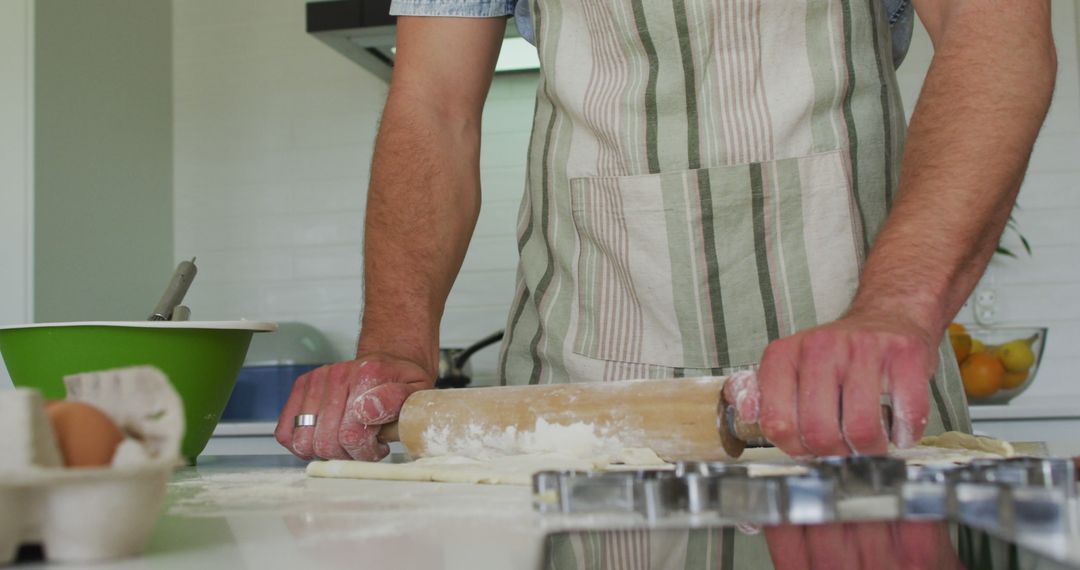 Man Rolling Dough in Kitchen Preparing Homemade Pastries - Free Images, Stock Photos and Pictures on Pikwizard.com