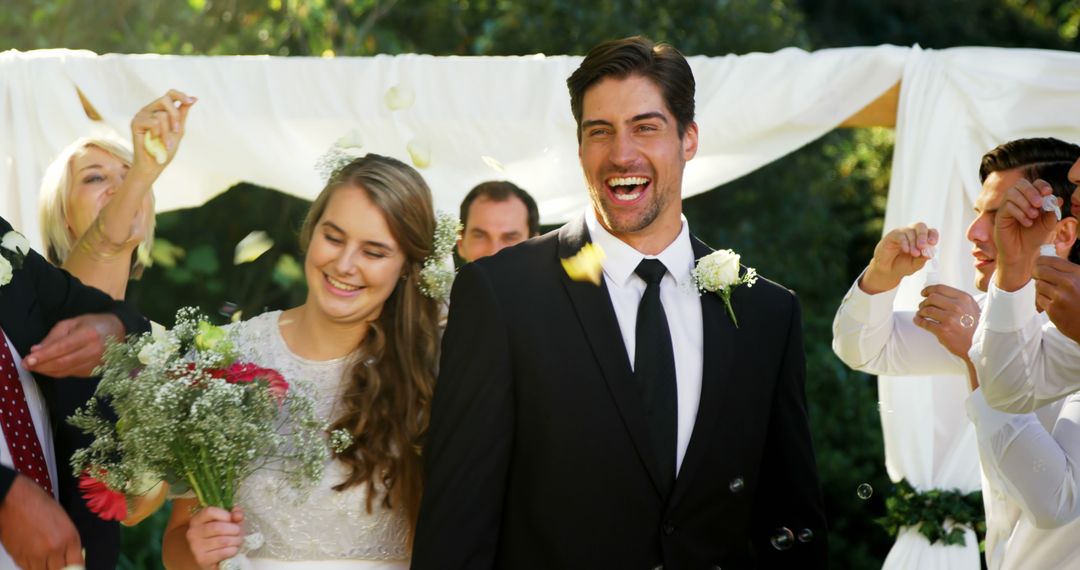 Happy Newlyweds Celebrating Outdoor Wedding Ceremony - Free Images, Stock Photos and Pictures on Pikwizard.com