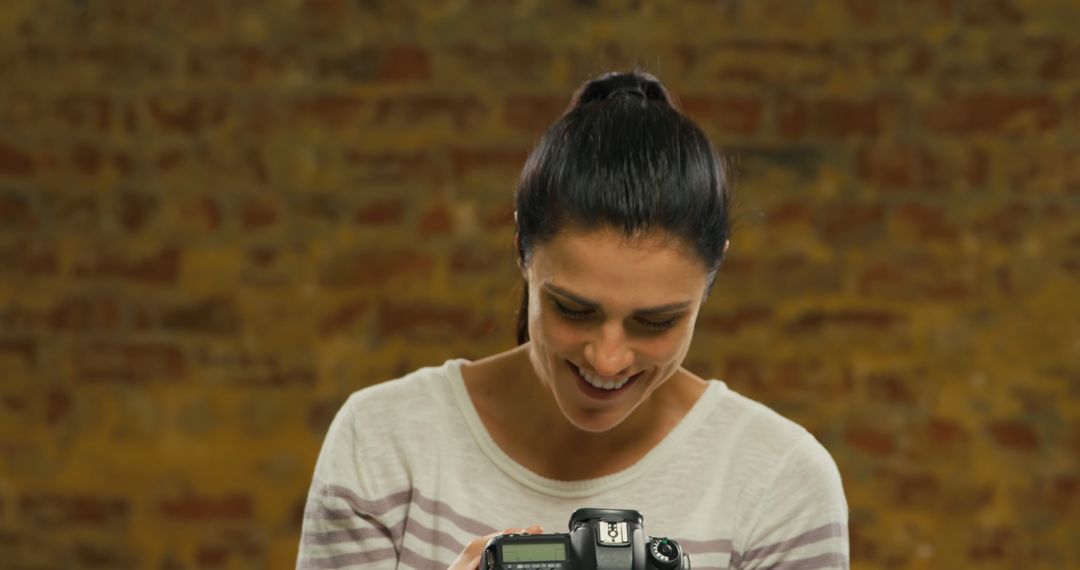 Woman Enjoying Photography Session with Camera - Free Images, Stock Photos and Pictures on Pikwizard.com