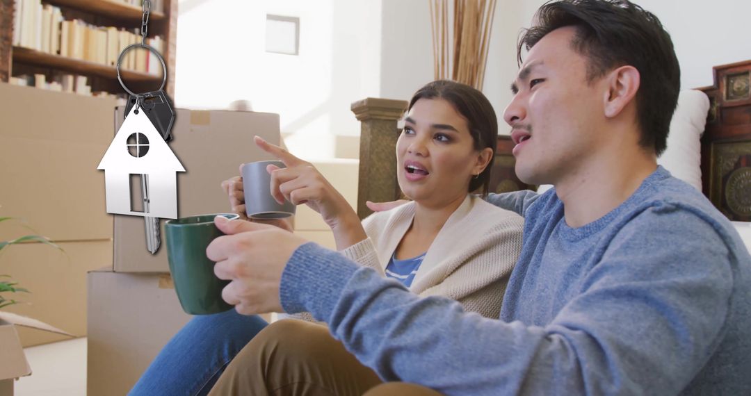 Happy Couple with Coffee Discussing New Home Plans